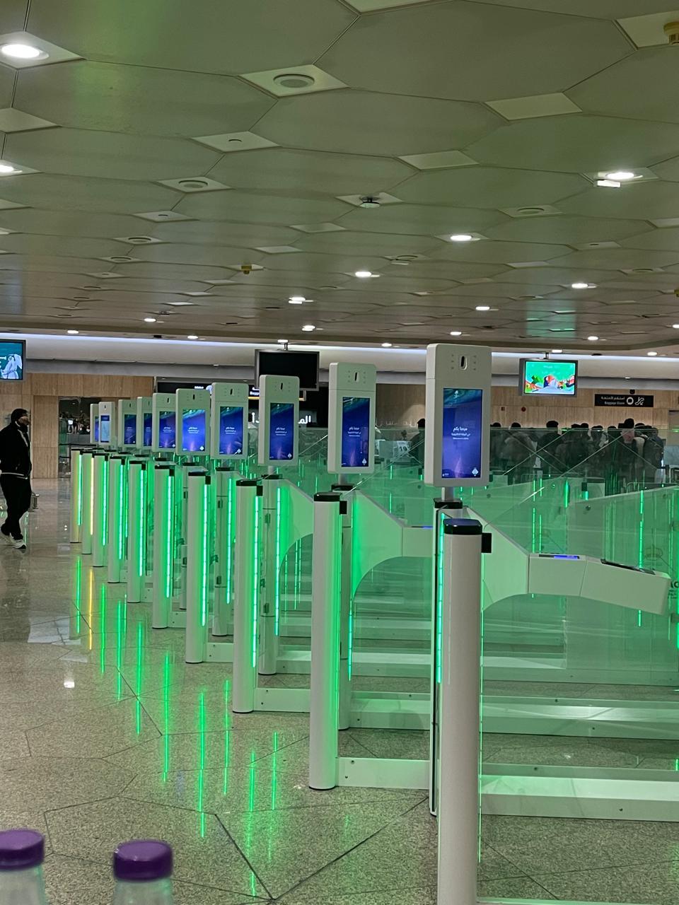 Airport e-gates shown for context. Alyam supplied or installed components, including fingerprint scanners and cameras, not the complete e-gates.
